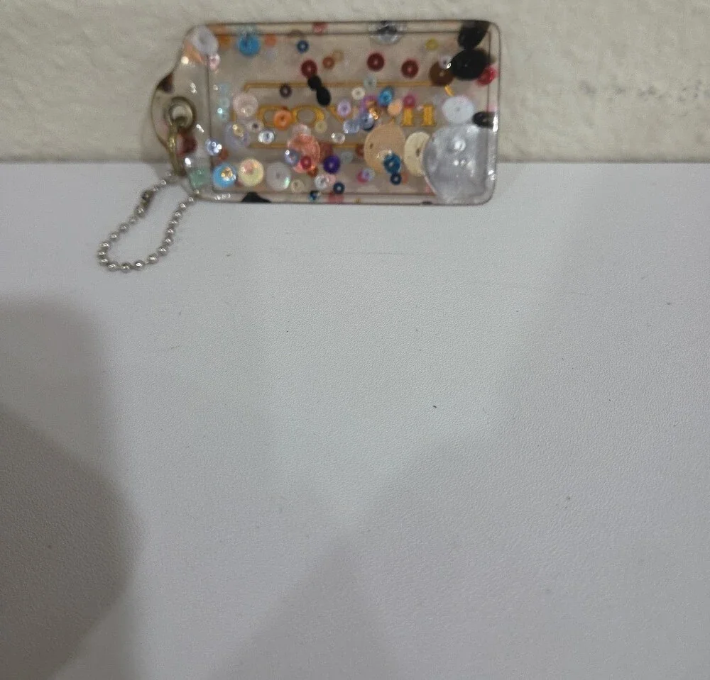 Coach Clear Confetti Acrylic Hang Tag  with Gold Logo
